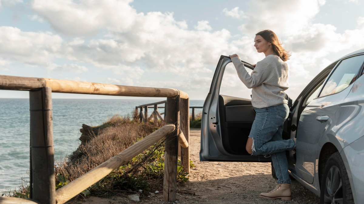 Woman stopping at coastal viewpoint