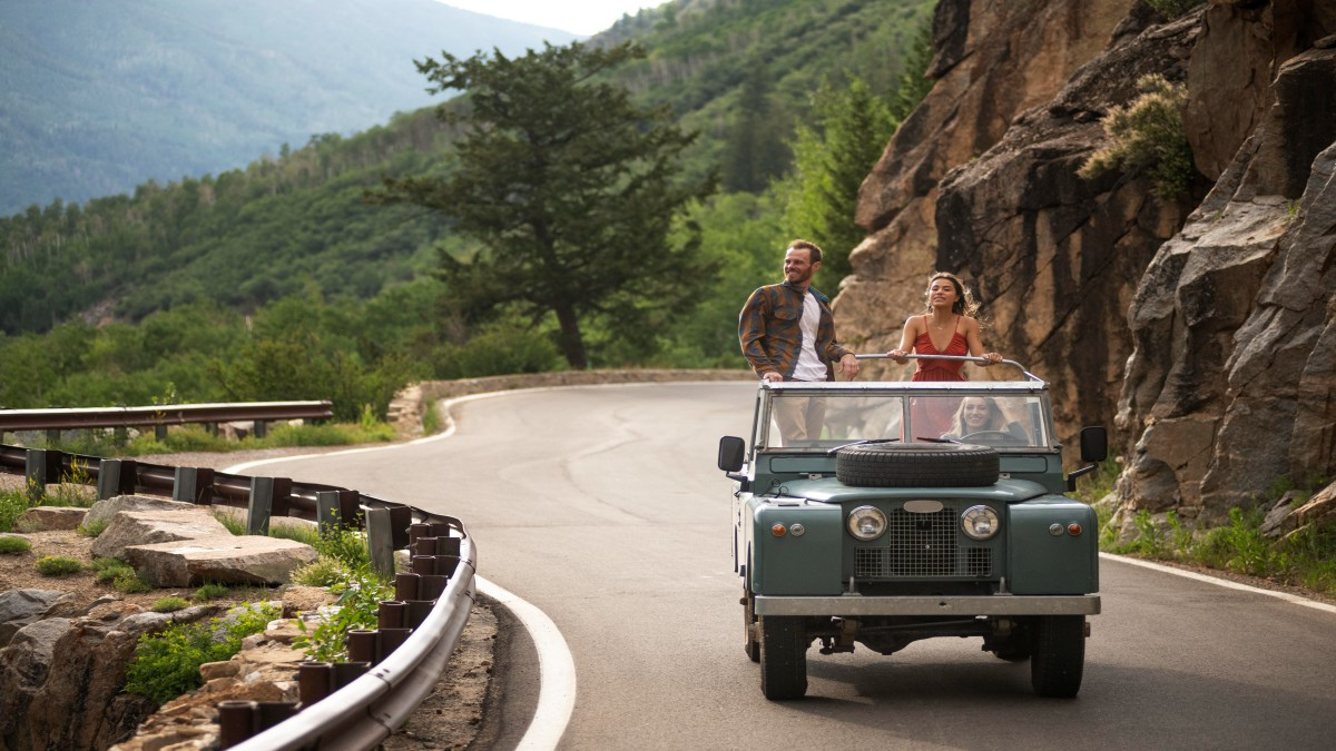 Couple driving through mountain road